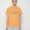 Vintage Supply FRONT EMBROIDERY LOGO TEE UNISEX - Basic T-shirt - Overdye Orange