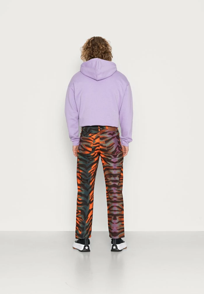 TIGER PRINTED - Straight leg jeans - orange